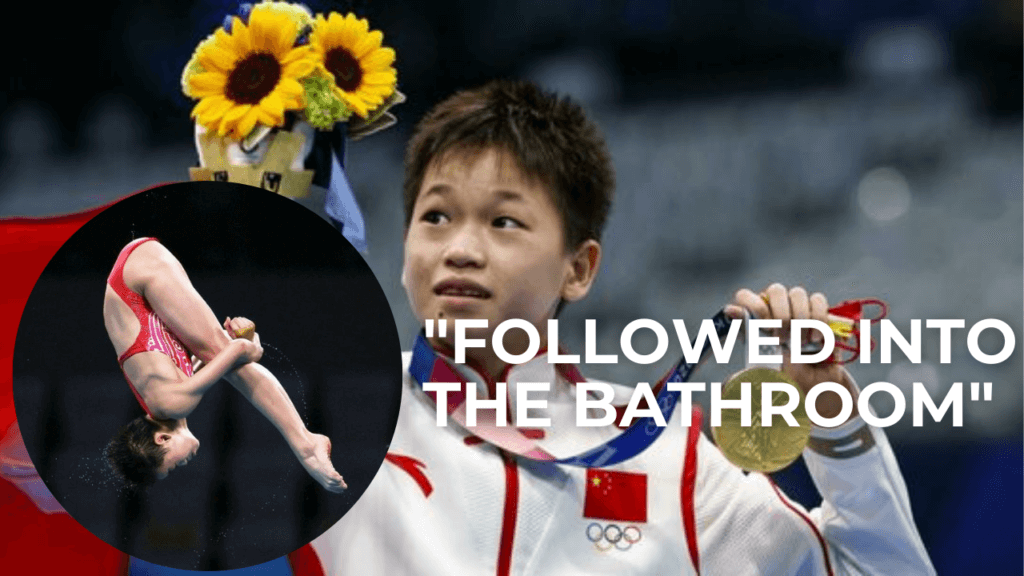 Quan Hongchan holding a flower and raising it up as she receives a gold medal