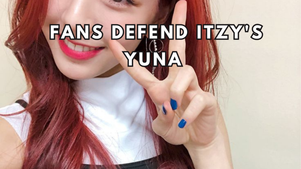 This contain an image of ITZY Yuna standing next to a toilet in a bathroom